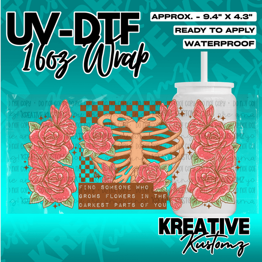 A floral and ribcage themed UV DTF adhesive wrap for a 16oz glass can.