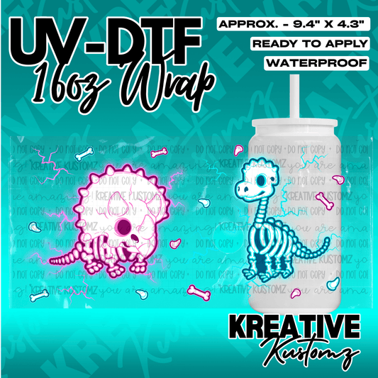 A UV DTF cup wrap featuring pink and blue skeleton dinosaurs with lightning accents.