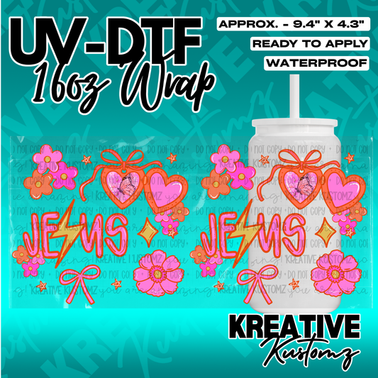 A vibrant UV DTF cup wrap featuring pink hearts, flowers, and the word Jesus in a script font.