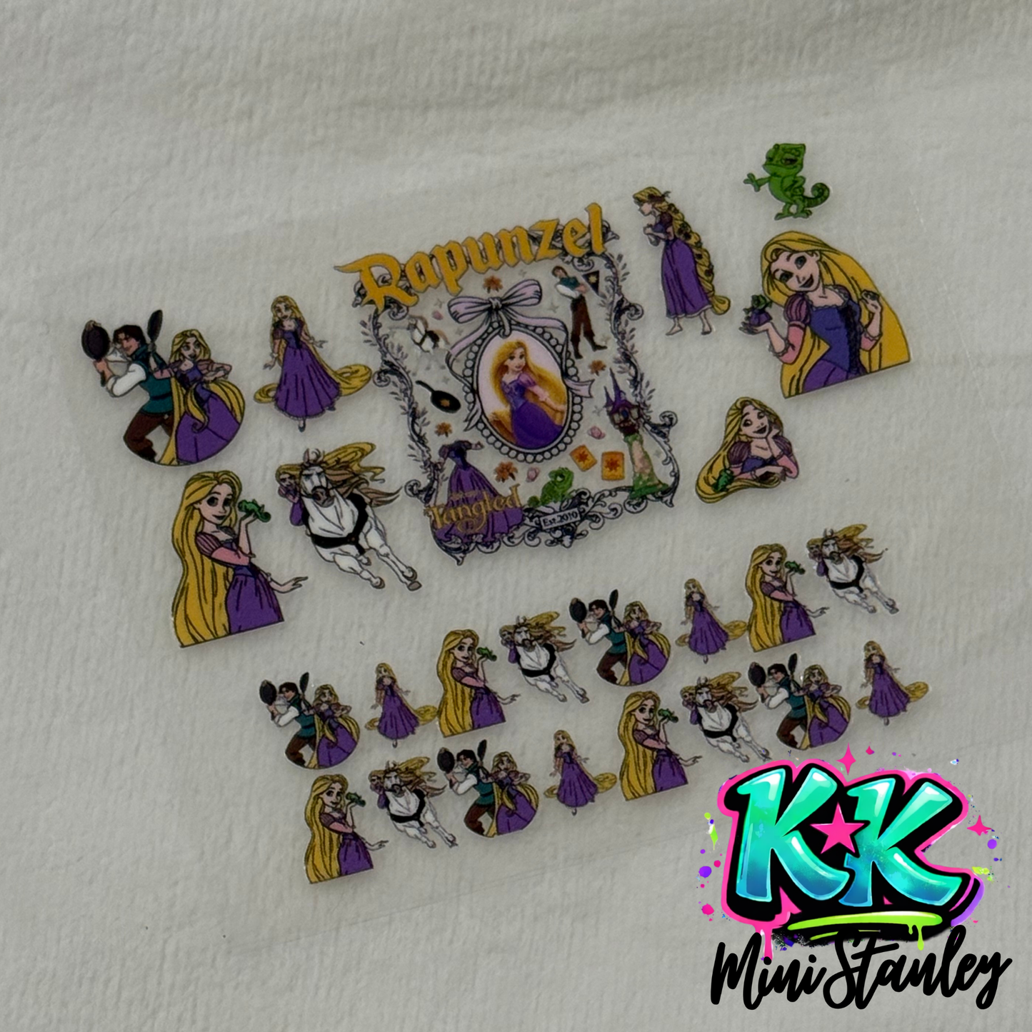 A sheet of Tangled themed UV DTF adhesive decals featuring Rapunzel and characters from the movie.