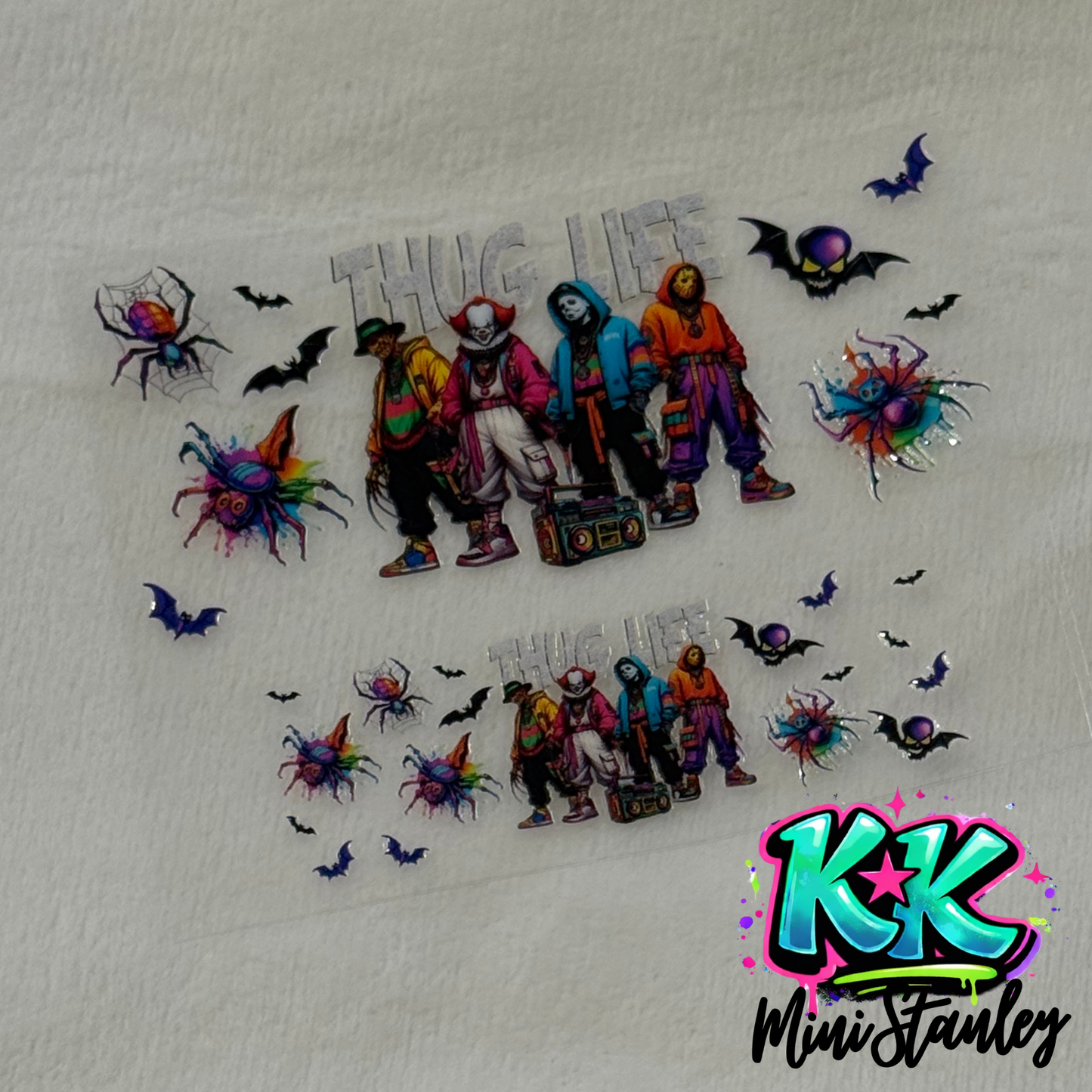 Two UV DTF adhesive wraps featuring horror movie characters, spiders, and bats on a white background.