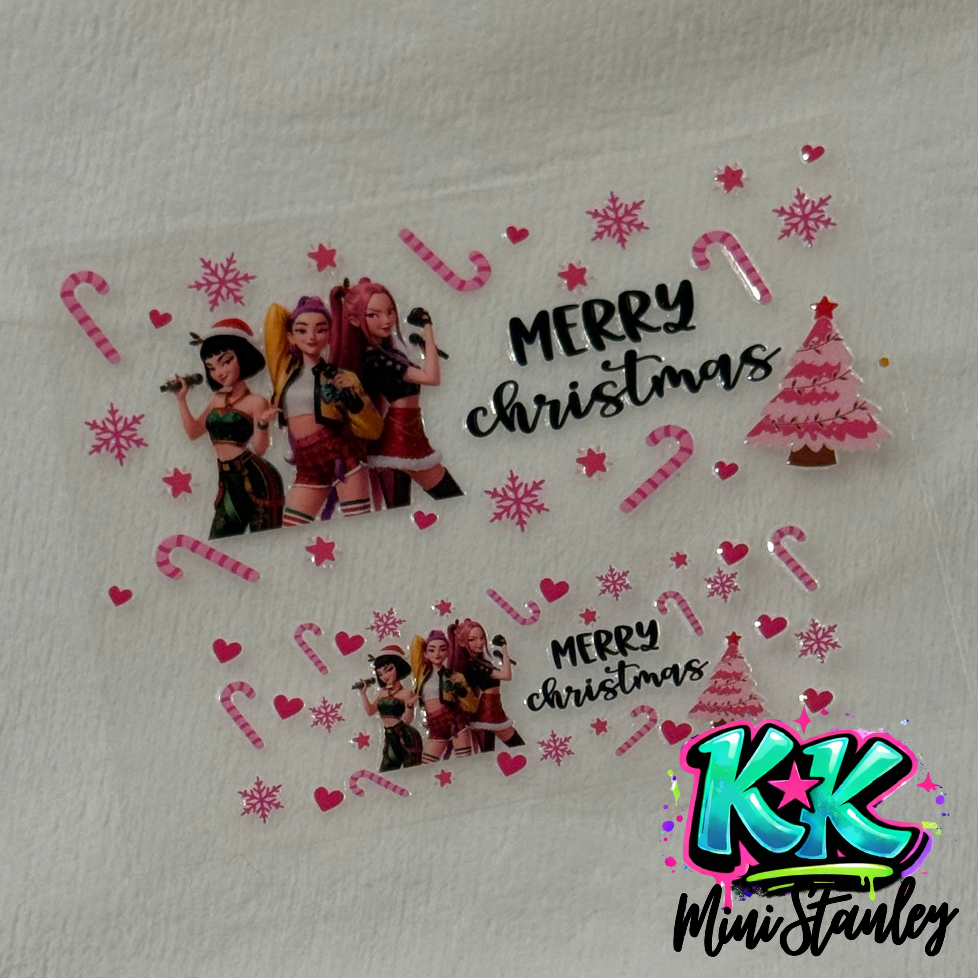 Two UV DTF adhesive wraps featuring K-pop characters, Christmas trees, and holiday decorations.