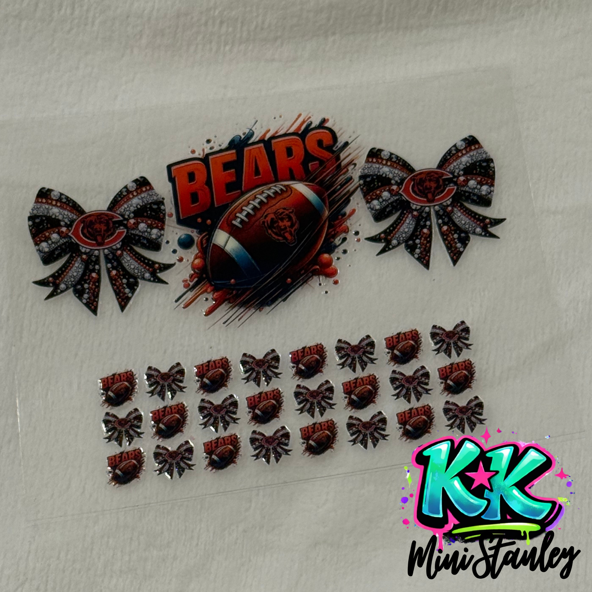 A UV DTF adhesive decal sheet featuring Chicago Bears football and cheer bow designs.