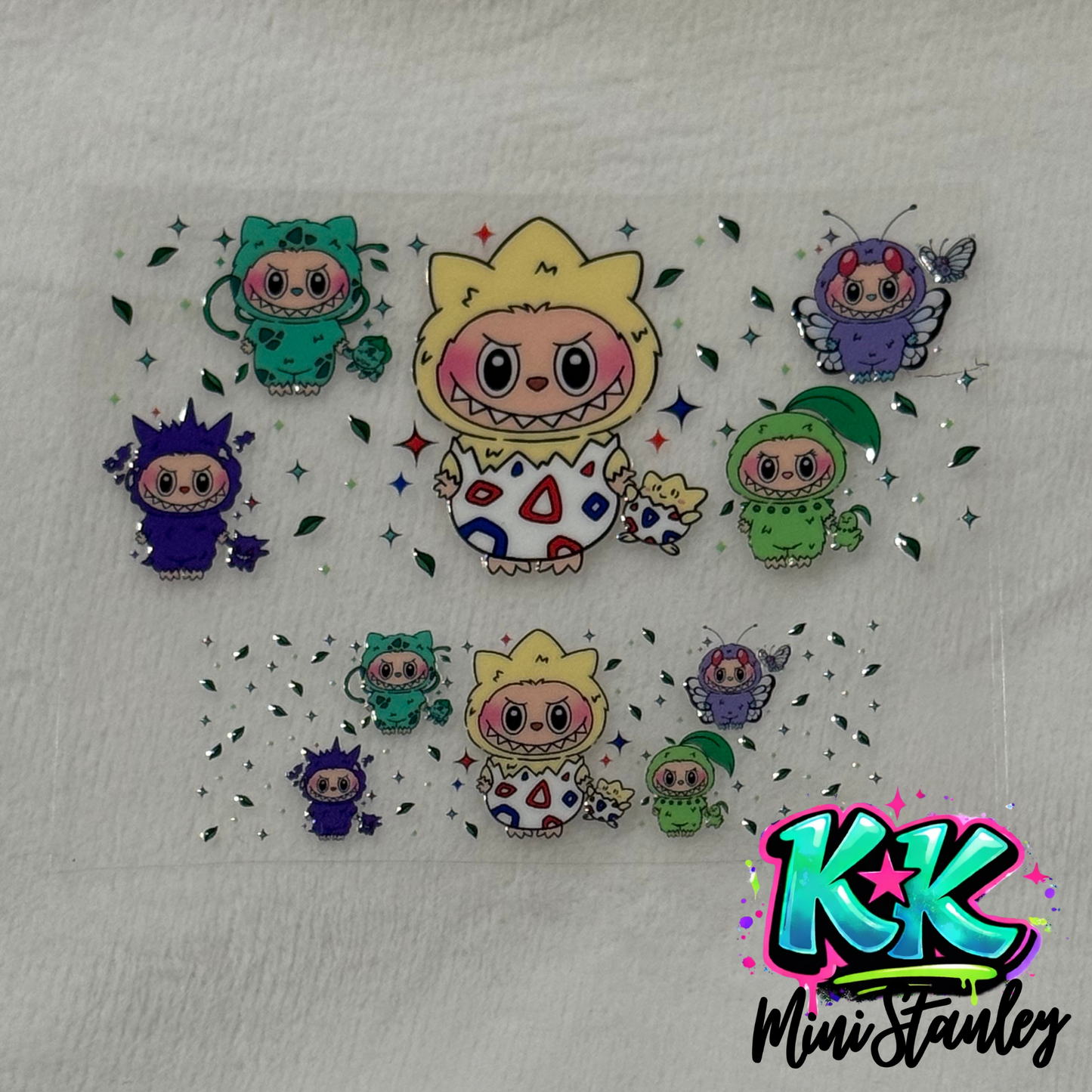 Two sheets of UV DTF decals featuring cartoon characters in animal costumes with star accents.