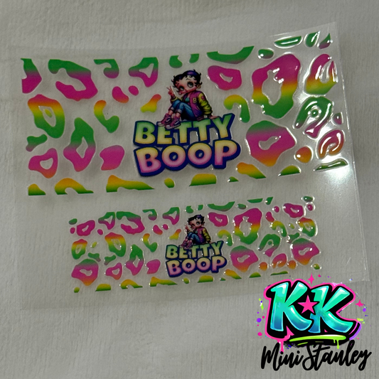 Two Betty Boop UV DTF decals with a colorful leopard print pattern on a clear backing.