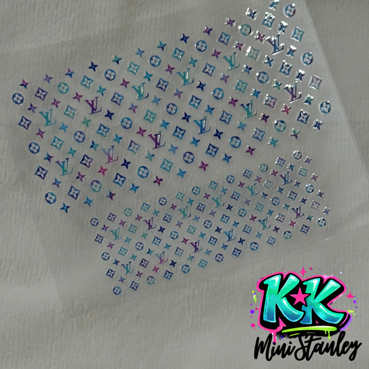 A sheet of iridescent floral and logo pattern UV DTF adhesive decals for mini cups.