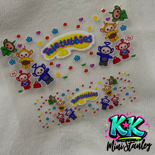 Two UV DTF adhesive wraps featuring Teletubbies characters, flowers, and hearts on a white surface.