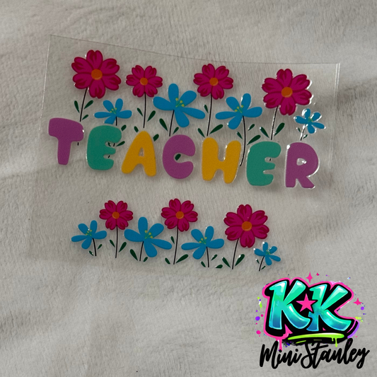A floral UV DTF transfer sheet featuring the word Teacher in colorful letters.