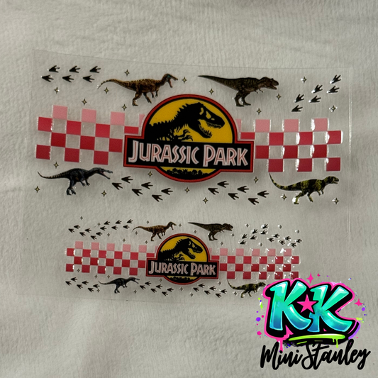 Two Jurassic Park themed UV DTF adhesive wraps for mini cups featuring dinosaurs and checkers.