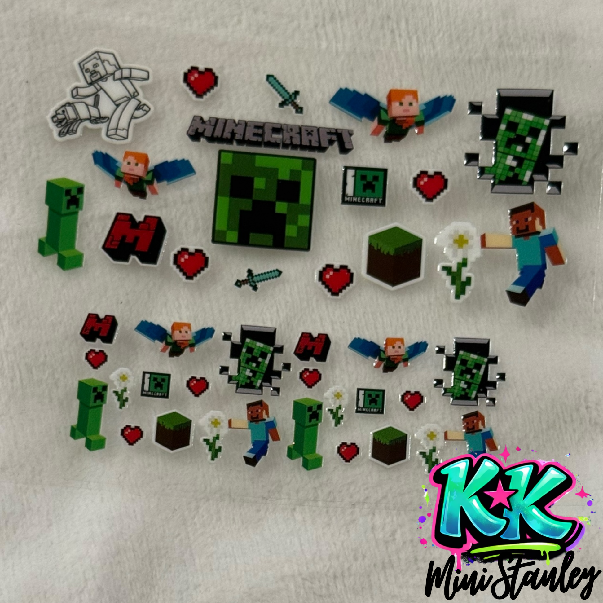 A sheet of Minecraft-themed UV DTF adhesive decals featuring characters, blocks, and icons.