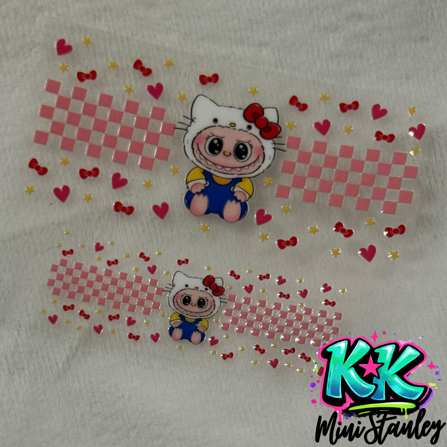 Two UV DTF adhesive wraps featuring a Hello Kitty character, pink checkerboard, and small icons.