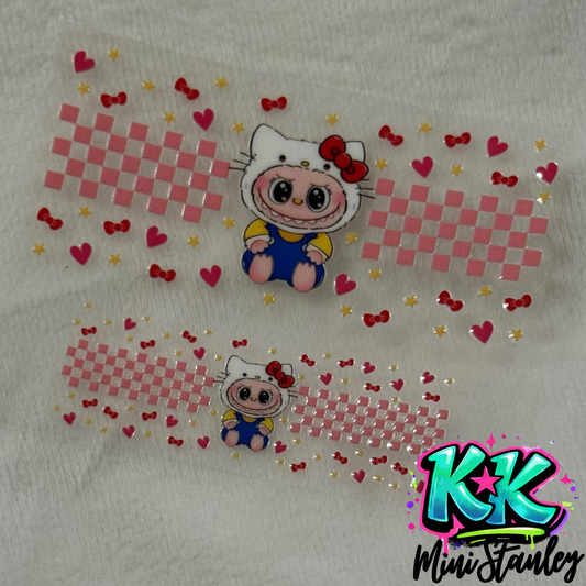 Two UV DTF adhesive wraps featuring a Hello Kitty character, pink checkerboard, and small icons.
