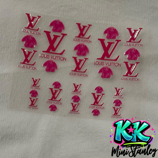 A sheet of pink Louis Vuitton logo and bunny character UV DTF adhesive transfers.