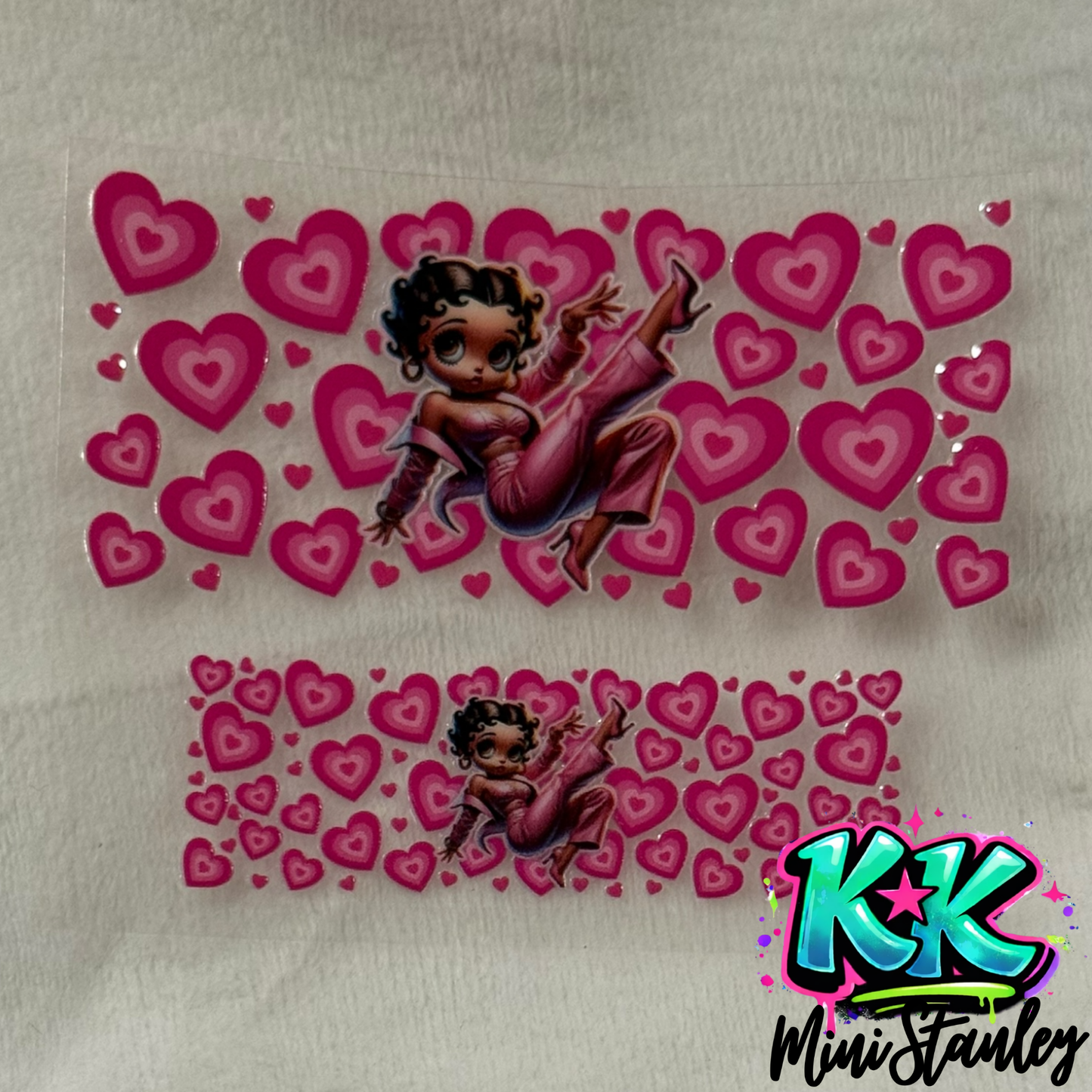 Two UV DTF adhesive wraps featuring Betty Boop surrounded by pink hearts on a clear backing.