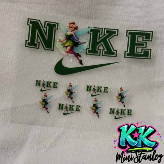UV DTF adhesive transfer sheet featuring Tinker Bell and Nike-inspired logos for mini keychains.
