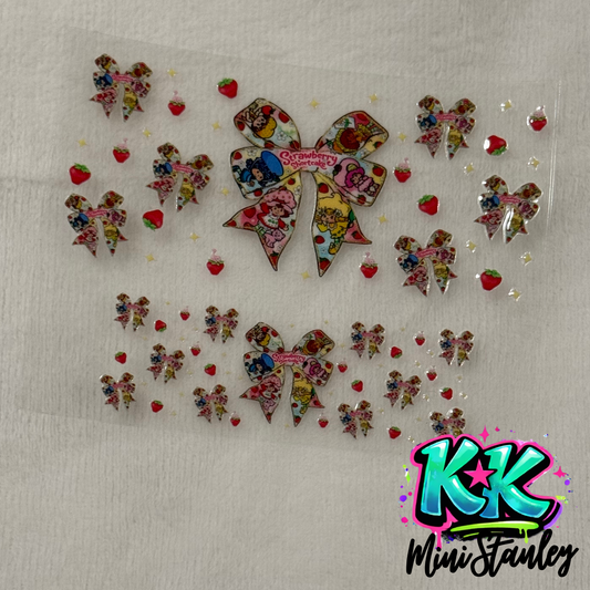 A Strawberry Shortcake themed UV DTF decal sheet featuring bows and strawberries for mini cups.