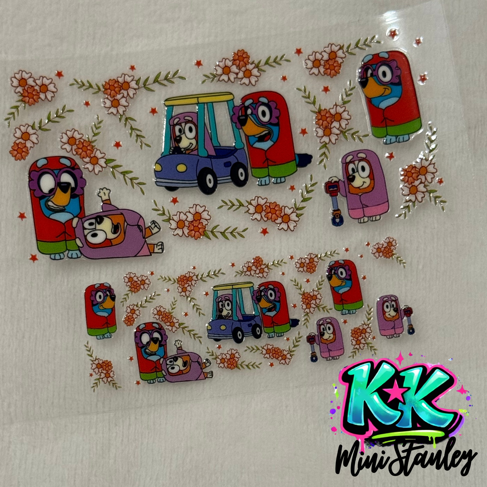 Two sheets of Bluey-themed UV DTF adhesive decals featuring characters and floral patterns.