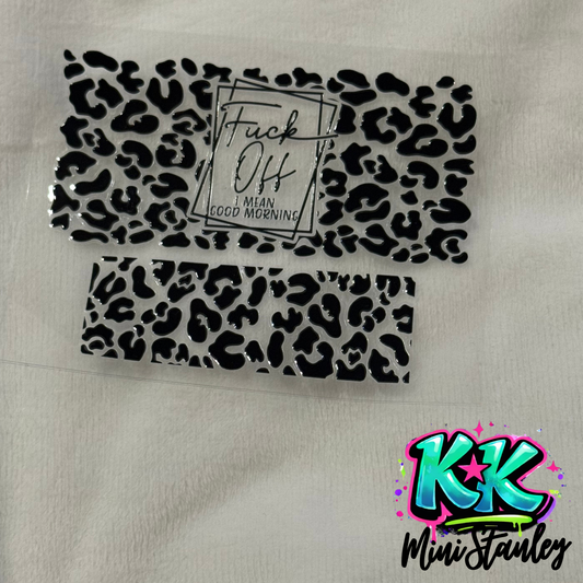 Two UV DTF adhesive transfers featuring a black leopard print and a text design.