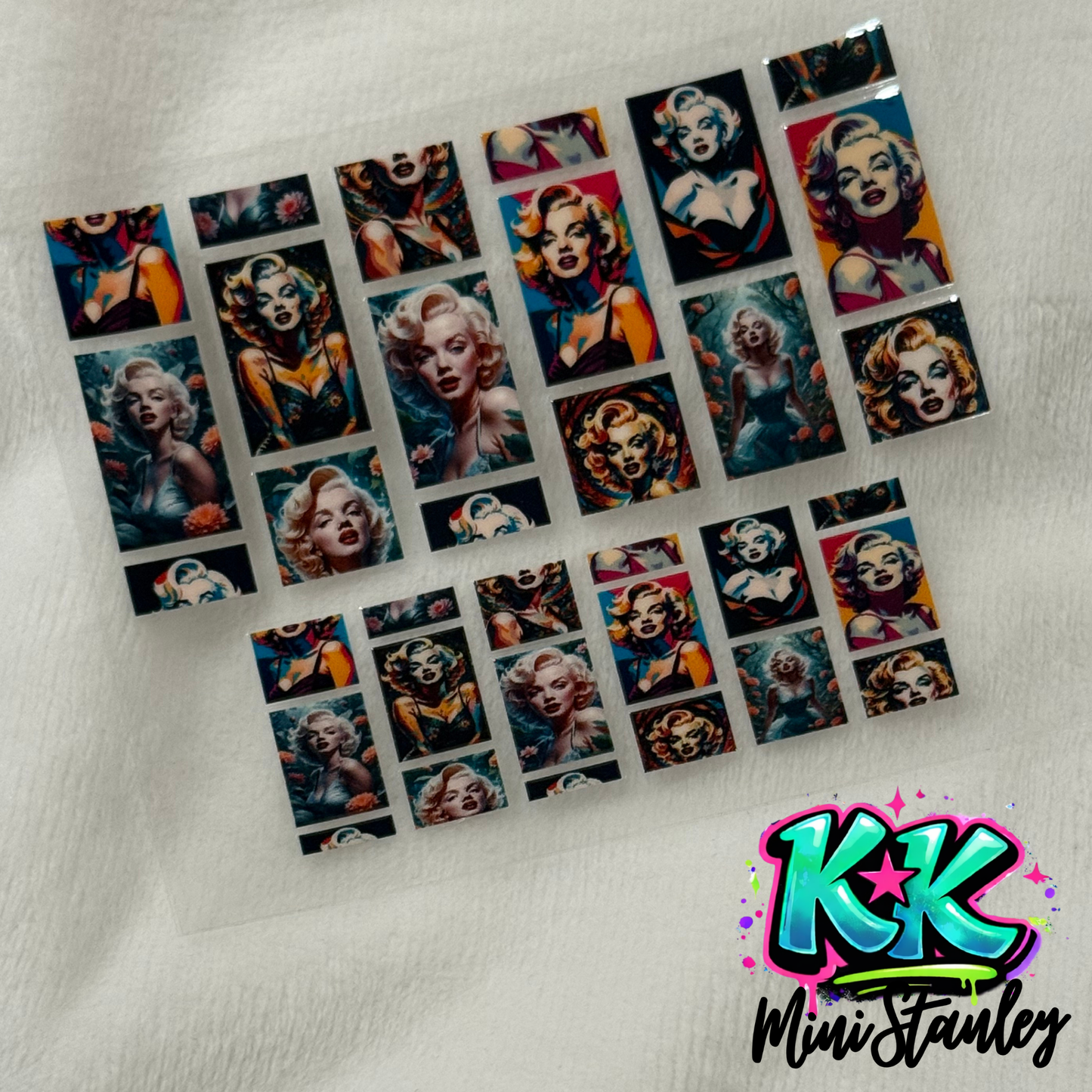 A sheet of UV DTF adhesive decals featuring various portraits of Marilyn Monroe.