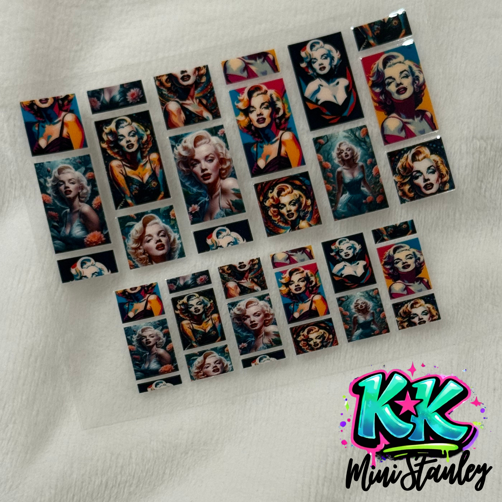 A sheet of UV DTF adhesive decals featuring various portraits of Marilyn Monroe.