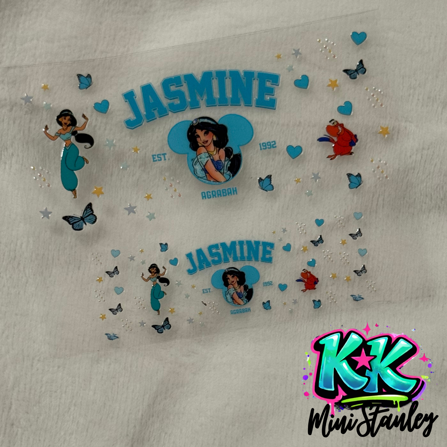 Two Jasmine themed UV DTF adhesive wraps featuring Princess Jasmine, Rajah, and butterfly accents.