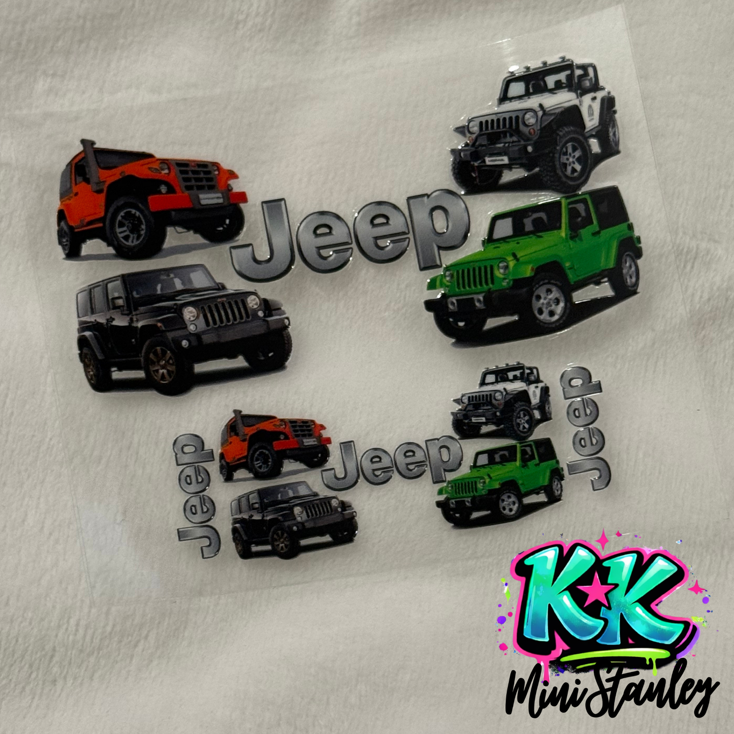 A UV DTF adhesive decal sheet featuring Jeep logos and various colored Jeep vehicle illustrations.