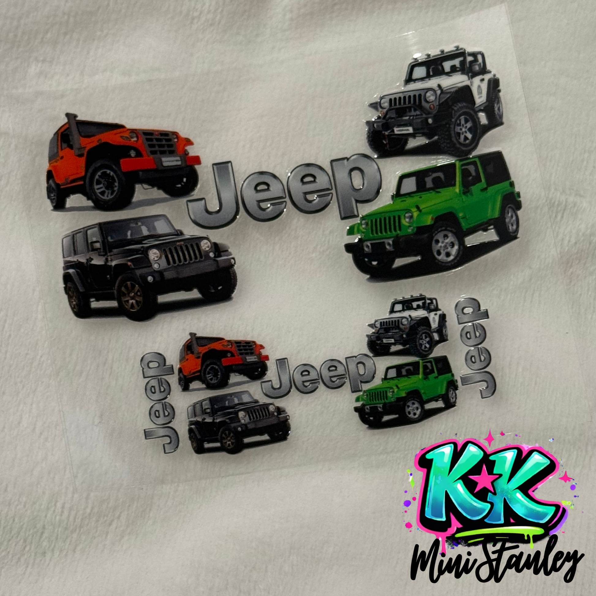 A UV DTF adhesive decal sheet featuring Jeep logos and various colored Jeep vehicle illustrations.