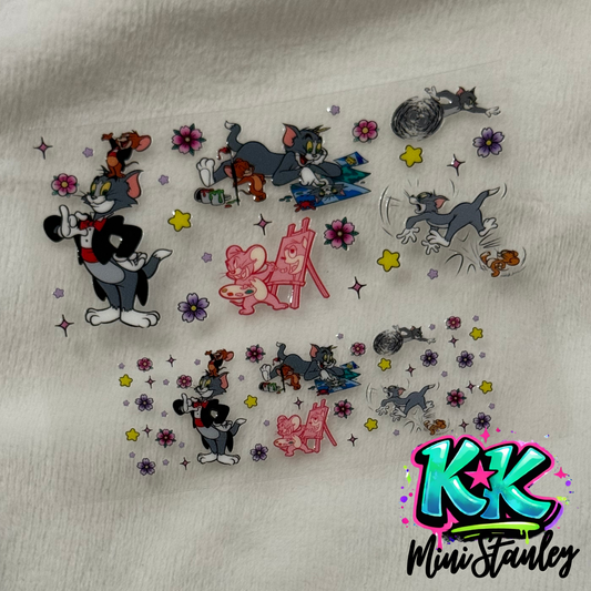 Two sheets of Tom and Jerry themed UV DTF adhesive transfers featuring floral accents.