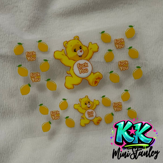 A UV DTF adhesive wrap featuring yellow bears and lemons with the phrase fuck you.