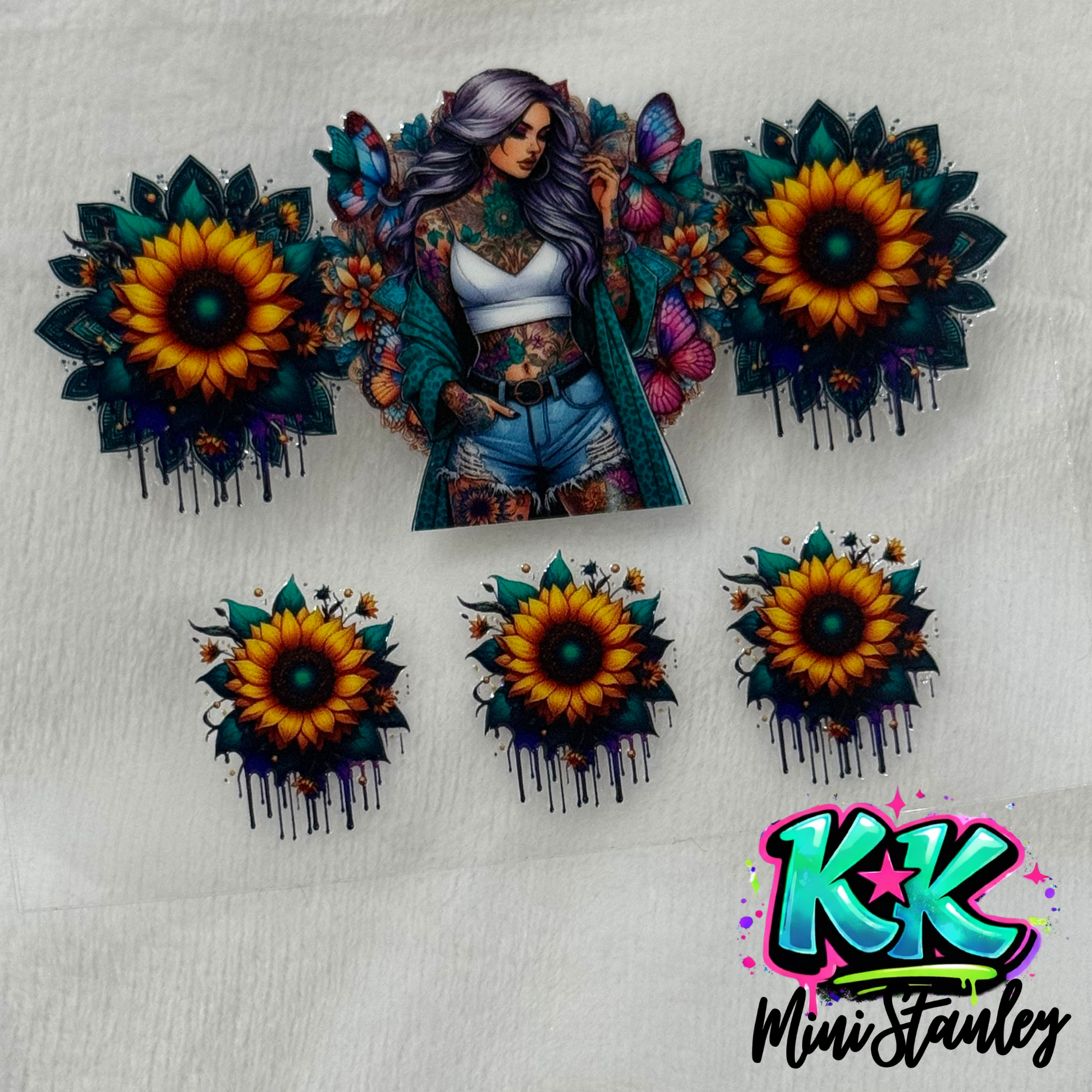 UV DTF adhesive wrap featuring a tattooed woman with sunflowers and butterflies for mini keychains.