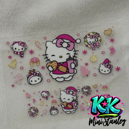 A UV DTF adhesive decal sheet featuring Hello Kitty holiday designs for mini keychains.