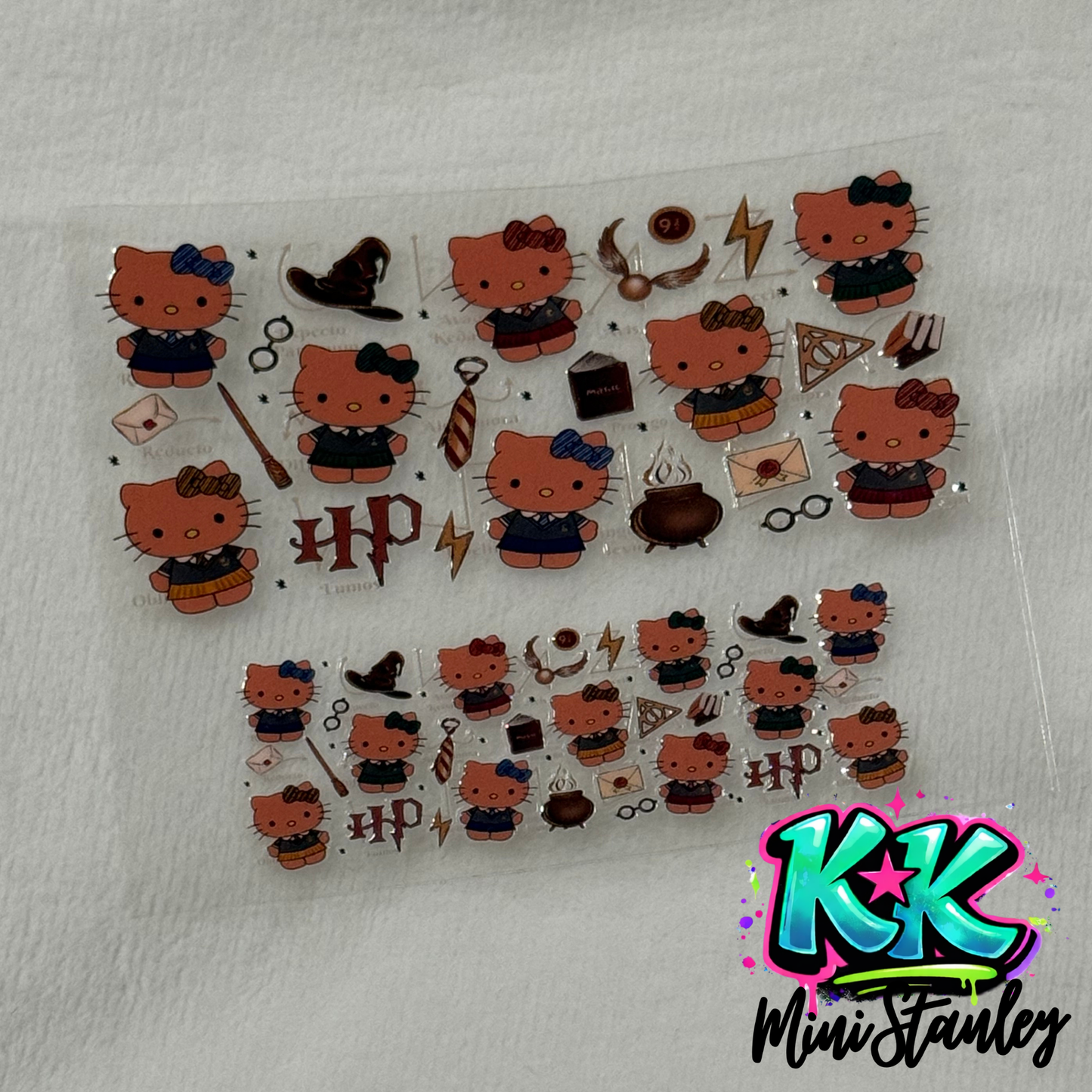 Two sheets of Harry Potter themed Hello Kitty UV DTF adhesive transfers for mini cups.