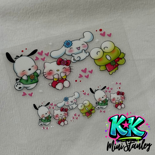 A UV DTF adhesive wrap featuring Sanrio characters like Hello Kitty for a mini keychain cup.