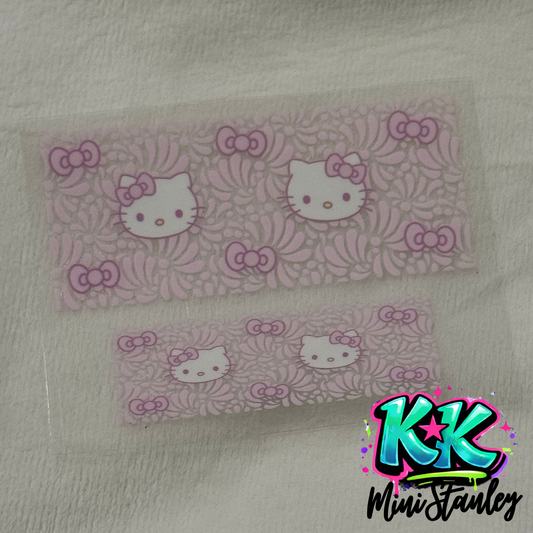 Two rectangular UV DTF adhesive wraps featuring a pink Hello Kitty and floral pattern.