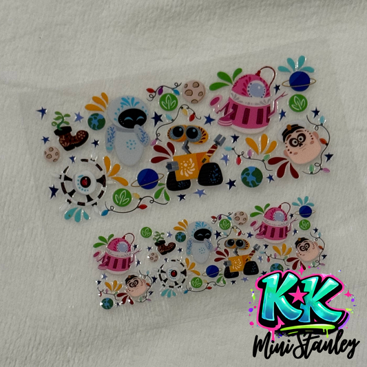 Two UV DTF adhesive wraps featuring Wall-E characters and space motifs for mini keychain cups.