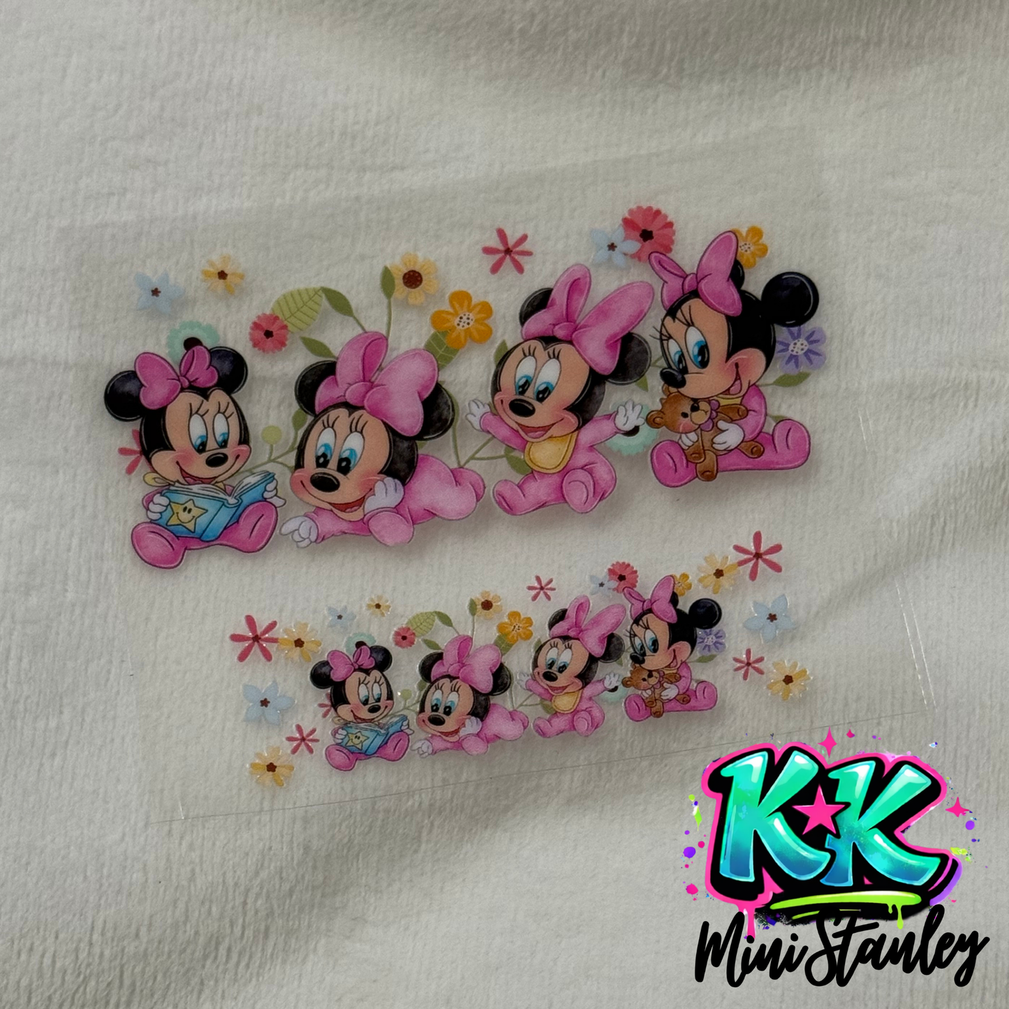 Two UV DTF adhesive transfers featuring baby Minnie Mouse with flowers on a clear backing.