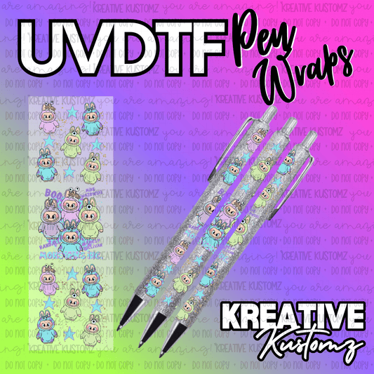 Three glittery pens decorated with Monsters Inc character decals on a colorful background.