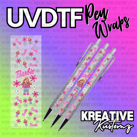 A Barbie themed UV DTF adhesive pen wrap featuring doll figures and flowers on a glittery pen.