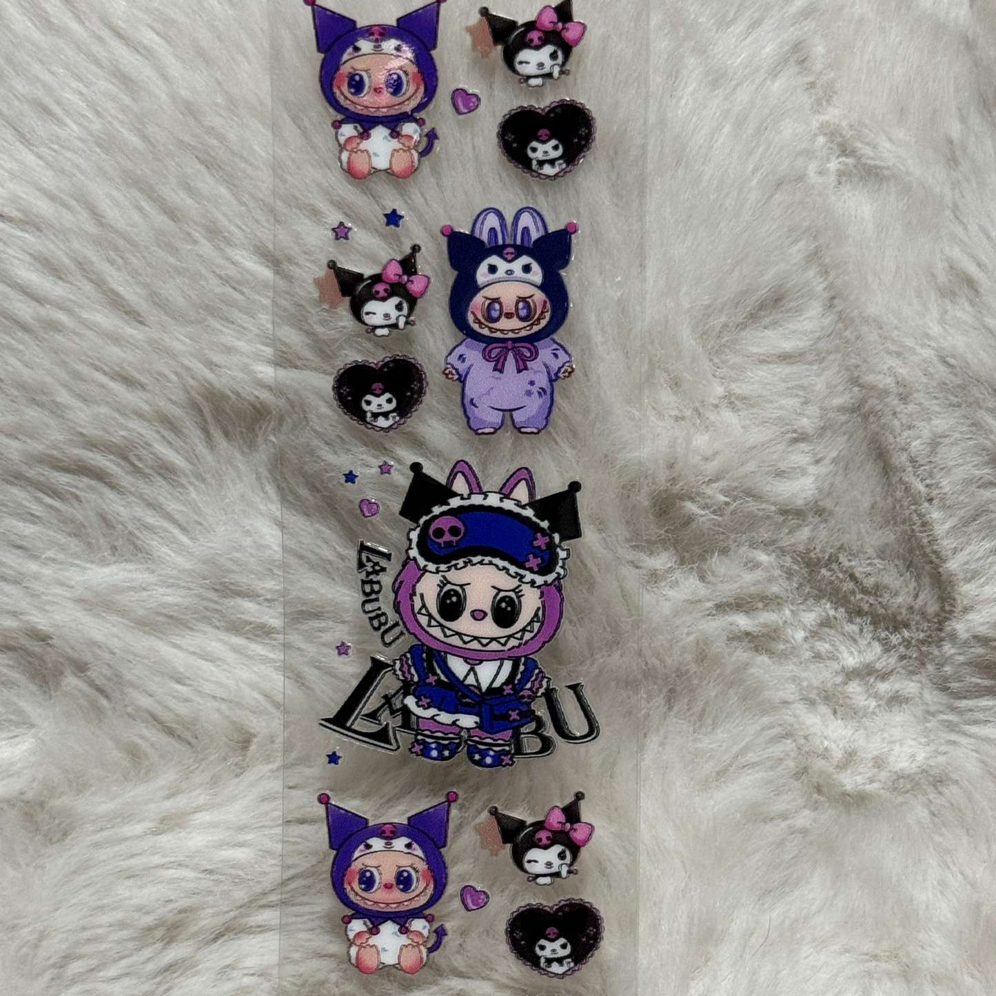 A UV DTF adhesive pen wrap featuring Labubu characters dressed in Kuromi-themed outfits.