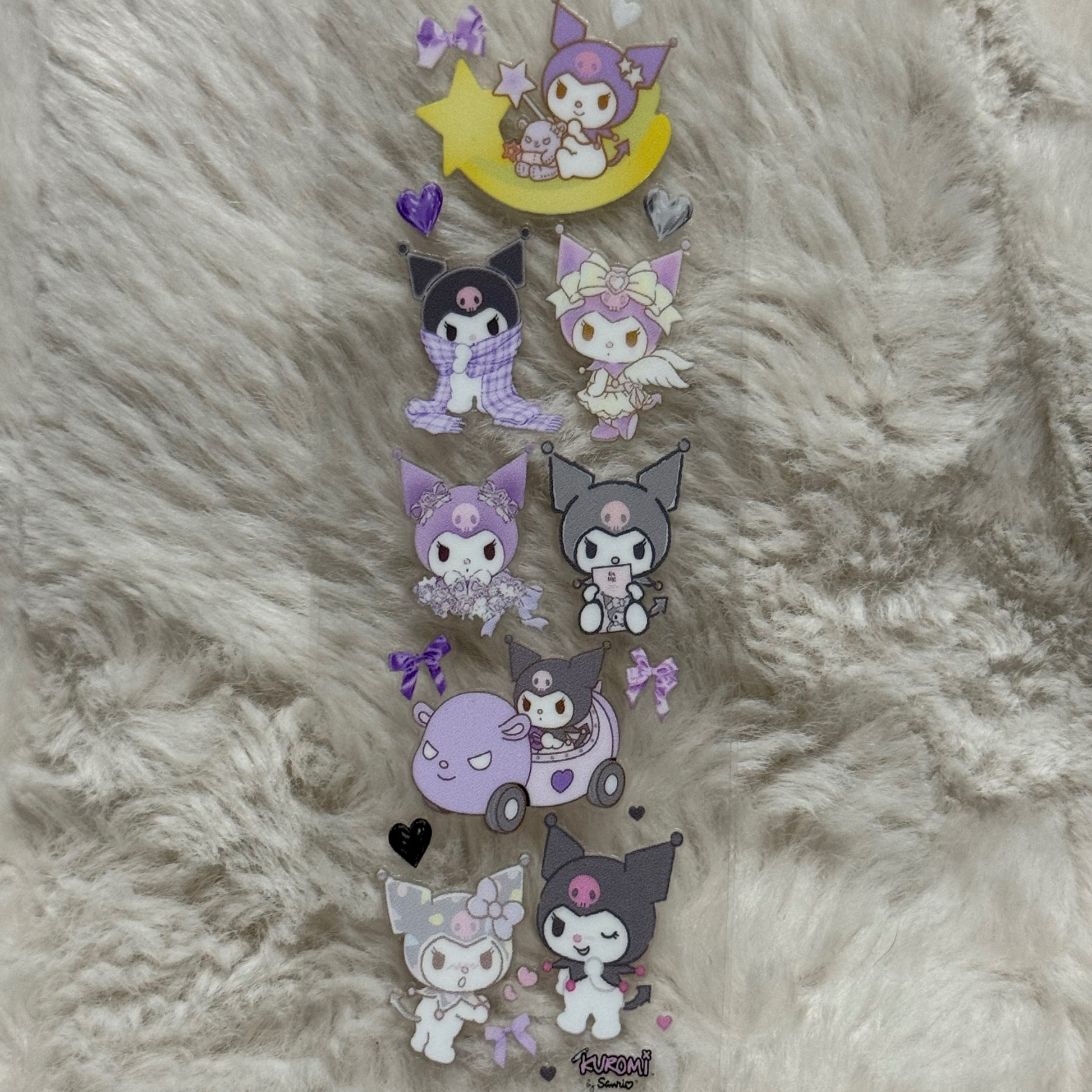 A vertical UV DTF adhesive pen wrap featuring various illustrations of the character Kuromi.