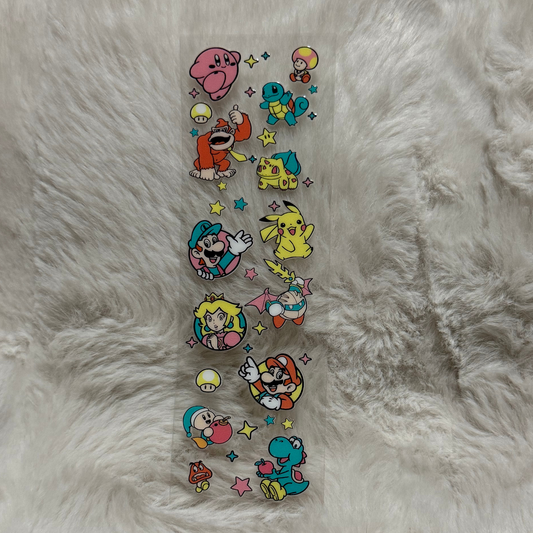 A clear adhesive pen wrap featuring various Nintendo and Pokemon character stickers.