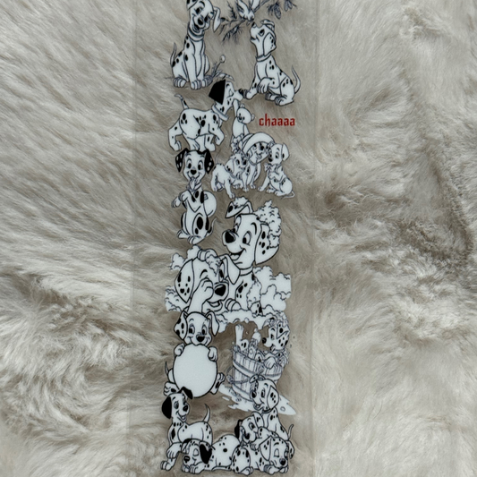 A clear UV DTF adhesive pen wrap featuring a pattern of Dalmatian puppies.