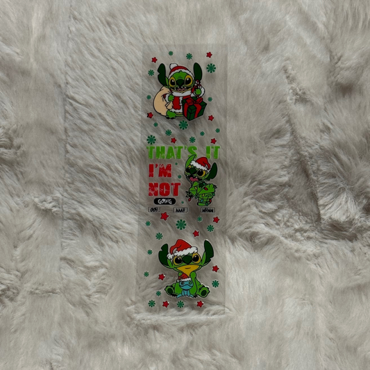 A clear UV DTF pen wrap featuring green Stitch characters in Santa hats and holiday text.