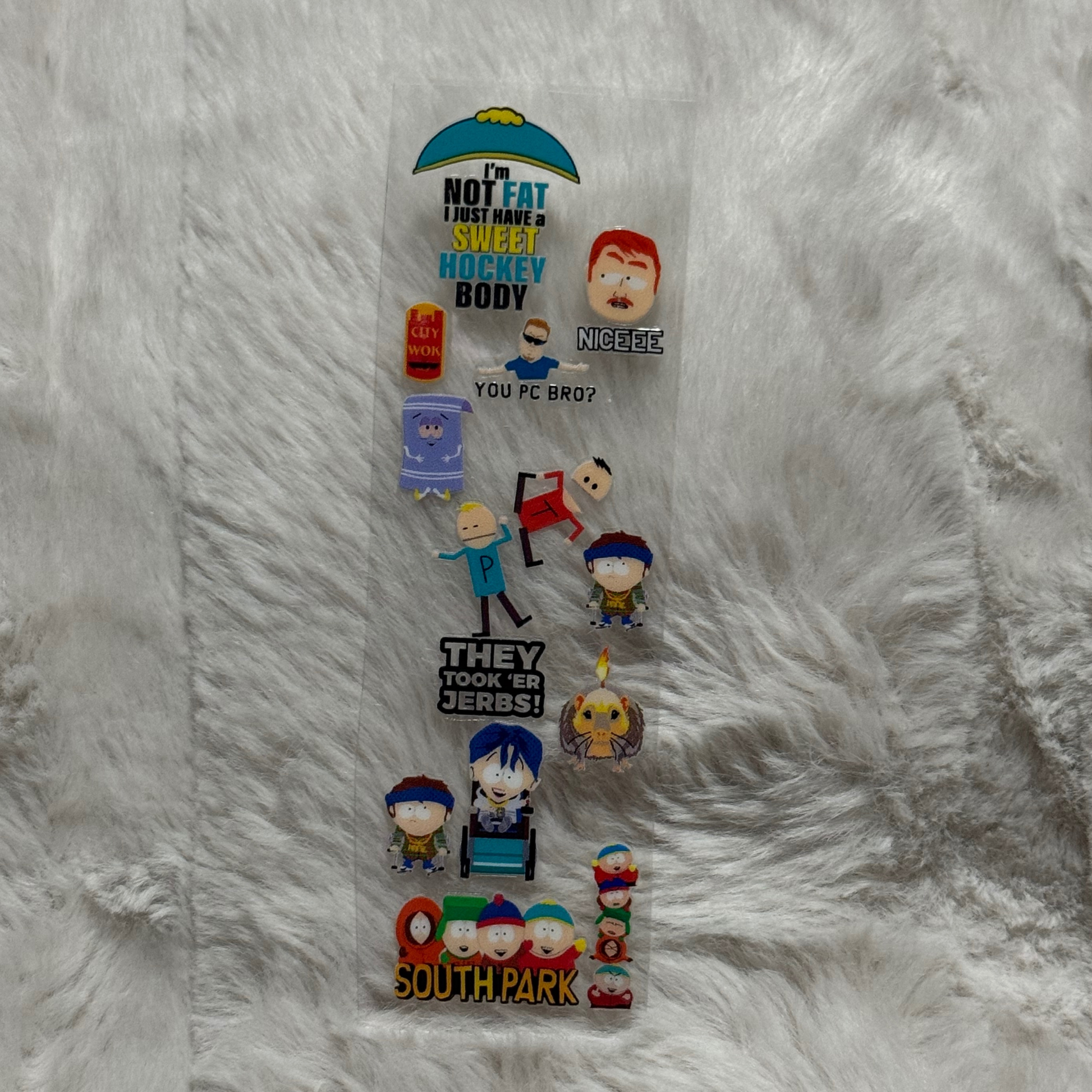 A South Park themed UV DTF adhesive pen wrap featuring various characters and quotes.