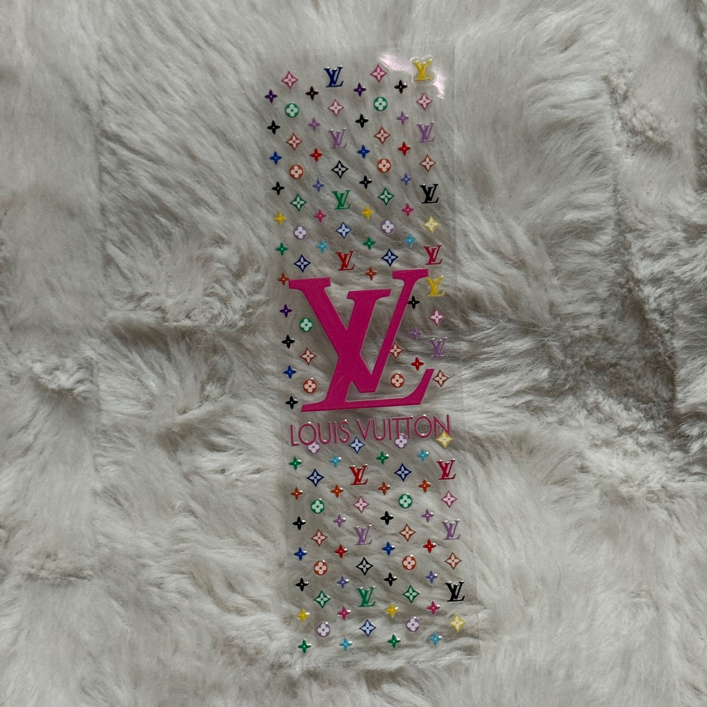 A rectangular UV DTF adhesive pen wrap featuring a colorful Louis Vuitton monogram pattern.