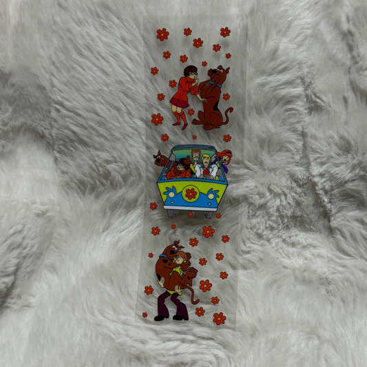 A clear adhesive pen wrap featuring Scooby-Doo characters and orange flowers on a white background.