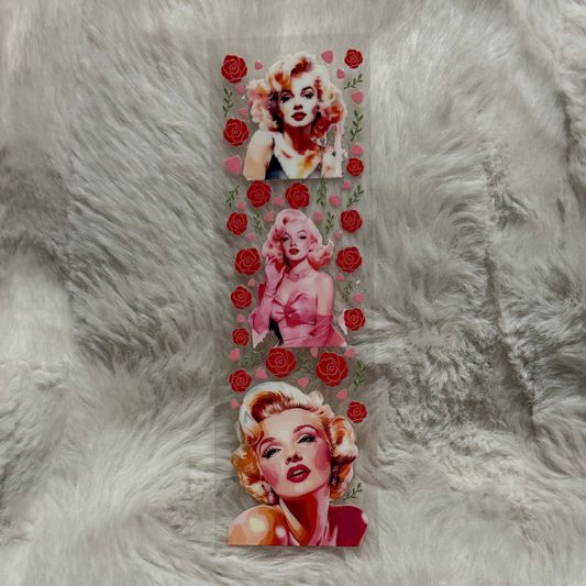 A rectangular UV DTF adhesive pen wrap featuring three portraits of Marilyn Monroe and red roses.