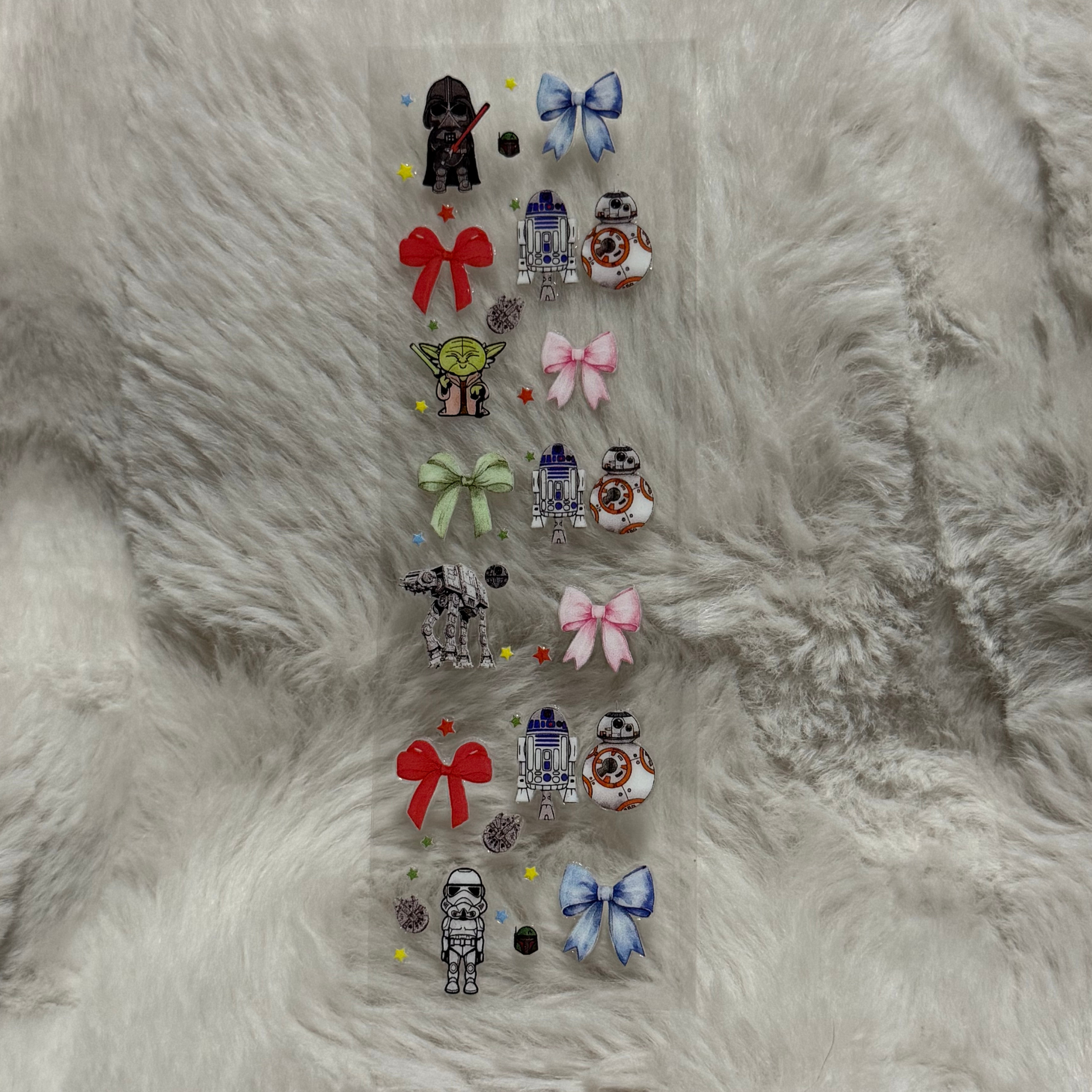 A rectangular sheet of Star Wars themed UV DTF stickers featuring characters and bows.