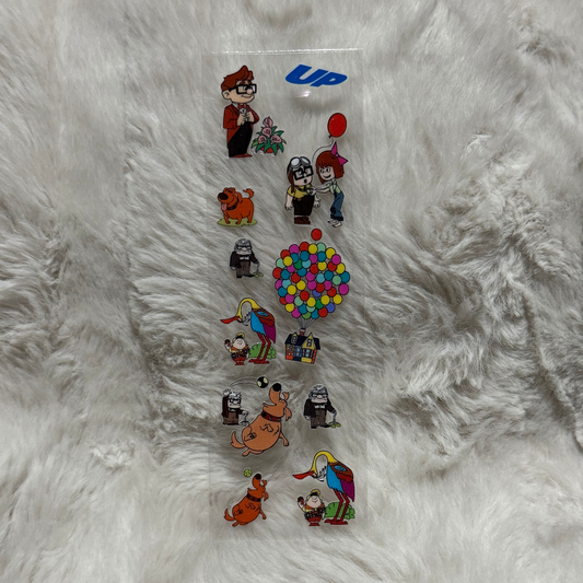 A clear sheet of UV DTF adhesive decals featuring various characters and icons from the movie Up.