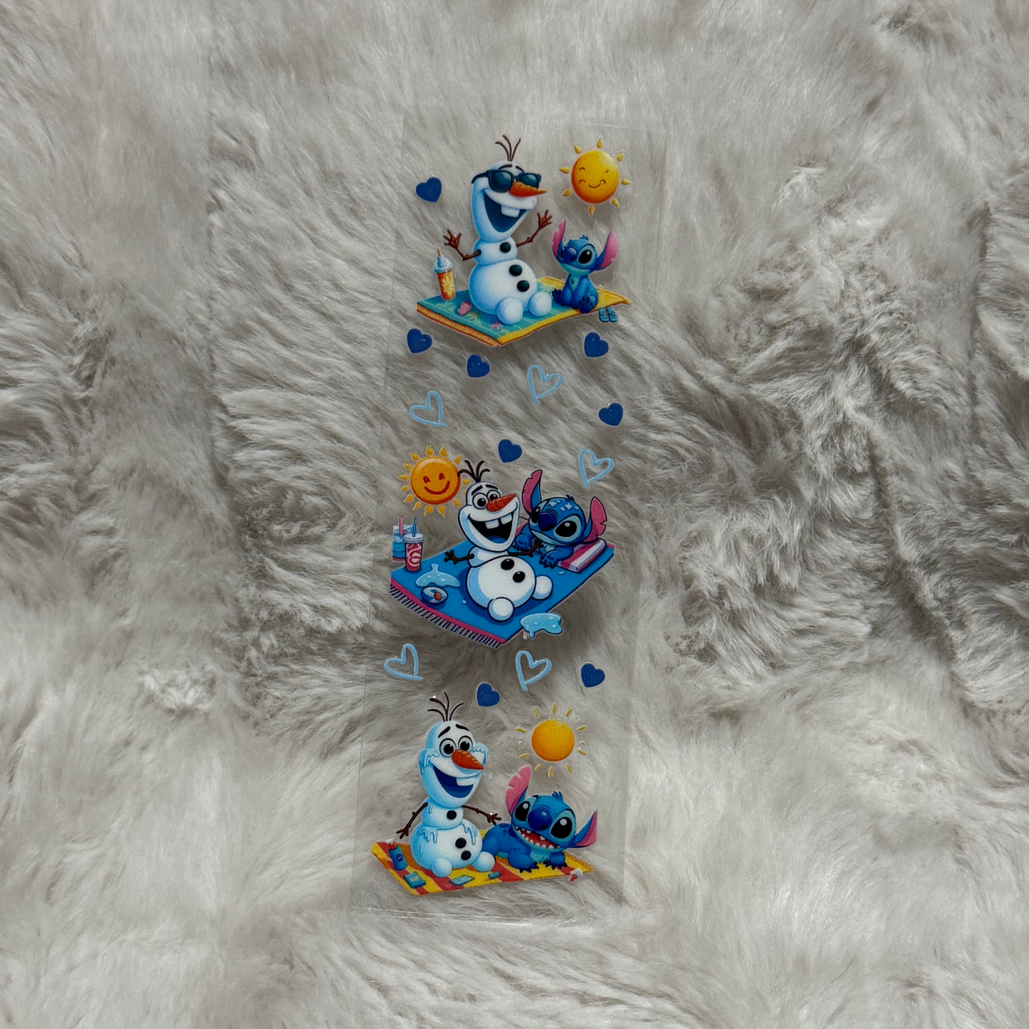 A rectangular UV DTF adhesive pen wrap featuring three scenes of Olaf and Stitch on a beach.